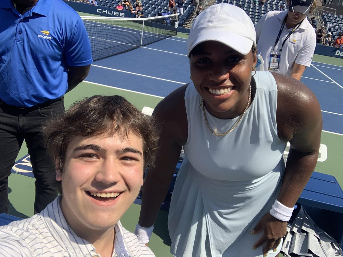 Taylor Townsend poses for a picture after her doubles victory