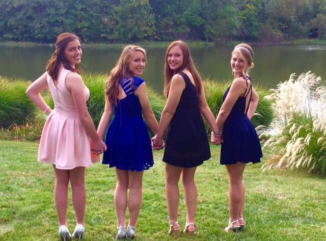 Jacqueline Gallagher, Alyssa Taylor, Sarah Locke, and Sarah Hacker taking pictures before the dance.