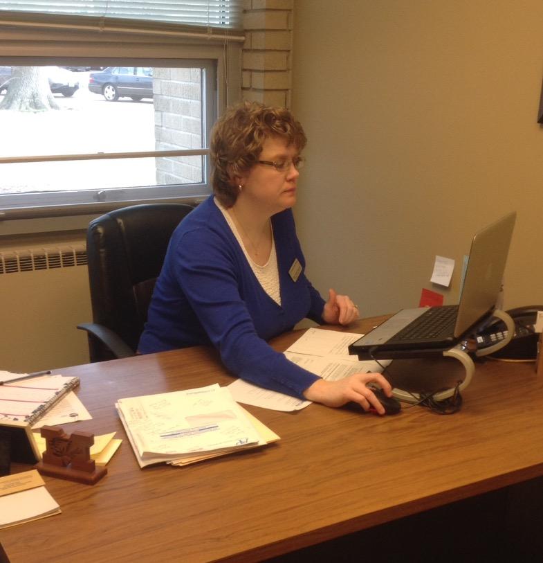 Mrs. Strecker preparing for registration. 