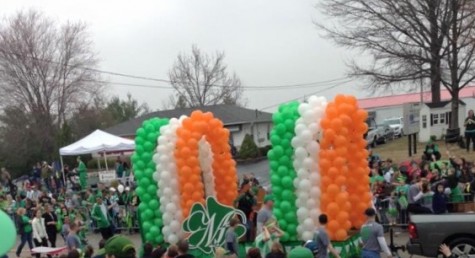 The Welby family's float displays the Irish colors at the Cottleville parade.