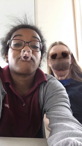 Juniors Dani Anjeh and Alexis Liszewski using the snapchat face swap filter.