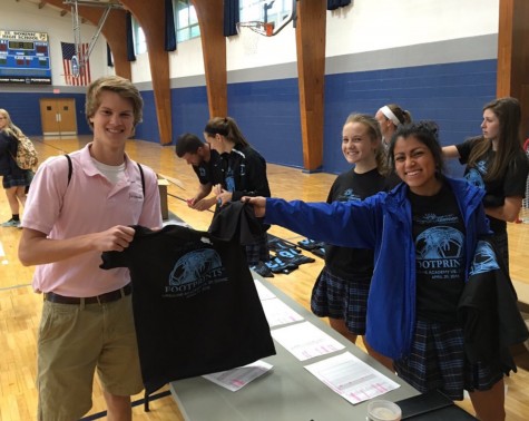 students soccer players selling footprints t-shirts