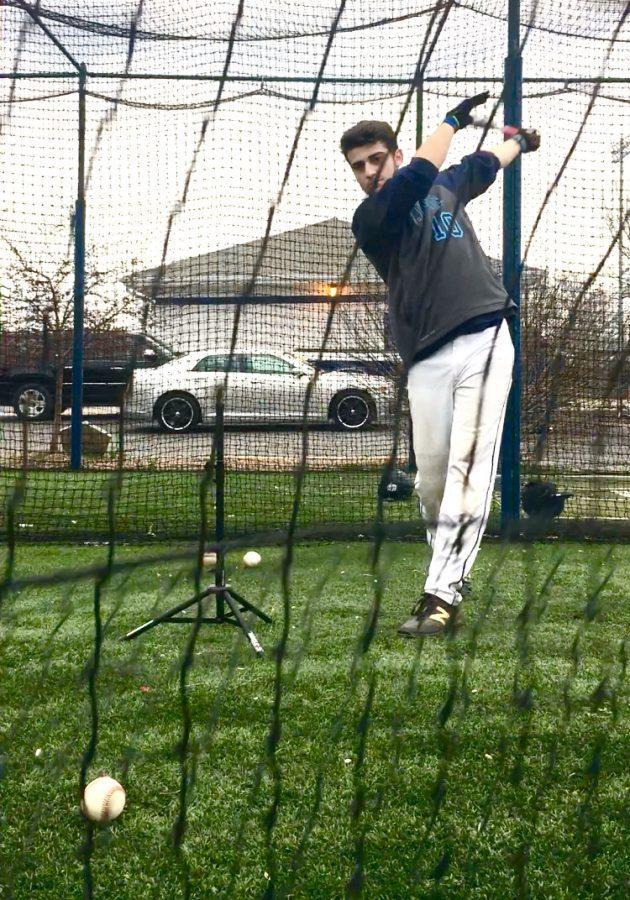 Senior Sam Pagano practicing his swing