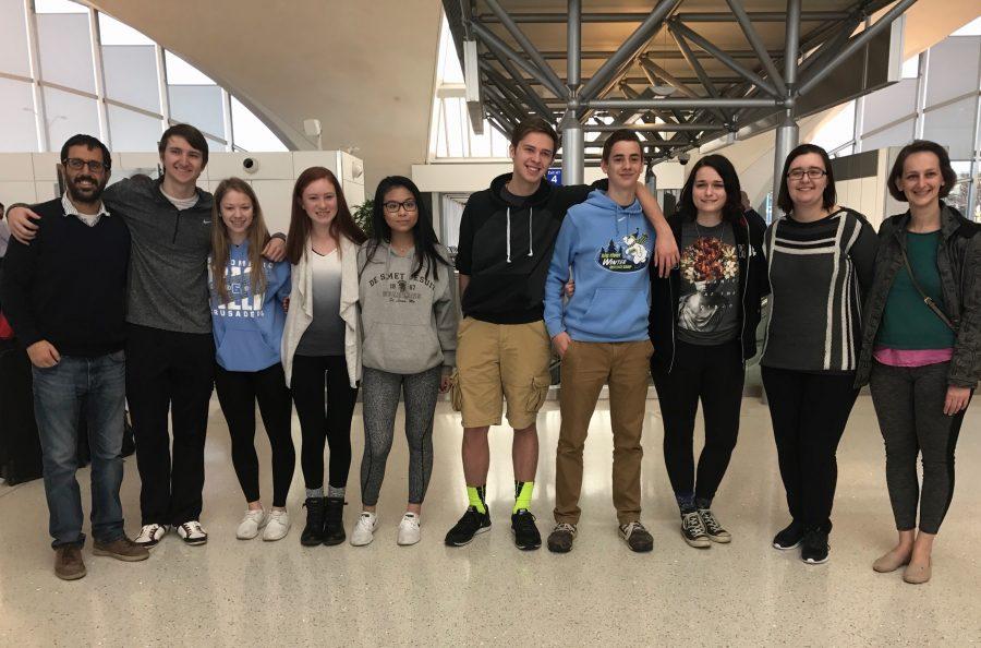 Mr. and Mrs. Morshed with SDHS students at St. Louis Lambert airport