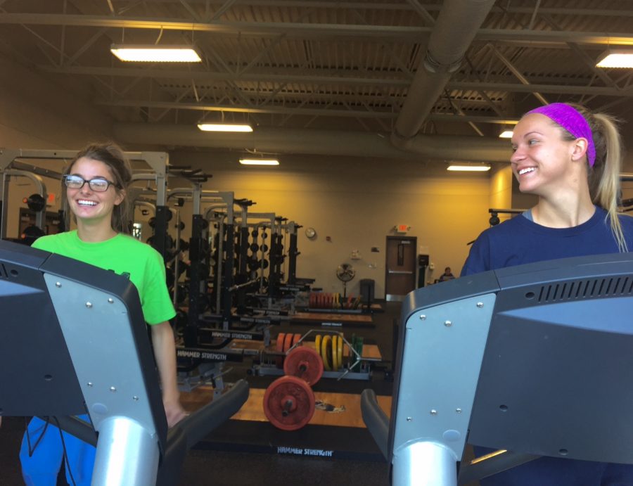 Seniors Mary Maloney and Madeline Bauer working out together