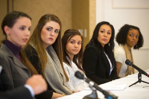 From the left; Rachael Denhollander, Sterling Riethman, Kaylee Lorincz, Jeanette Antolin and Tiffany Thomas appear at a press conference after Larry Nassar was sentenced to 60 years in prison on child pornography charges in Grand Rapids, Mich., on Thursday, Dec. 7, 2017. The women are some of the many former patients of Nassar who have accused him of molestation. Nassar was convicted of possessing child pornography and assaulting gymnasts.  (Mike Clark/The Grand Rapids Press via AP)