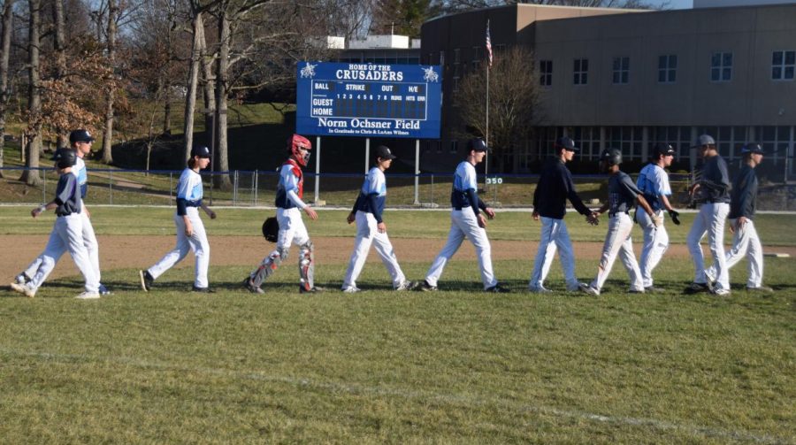 Varsity baseball players in action.