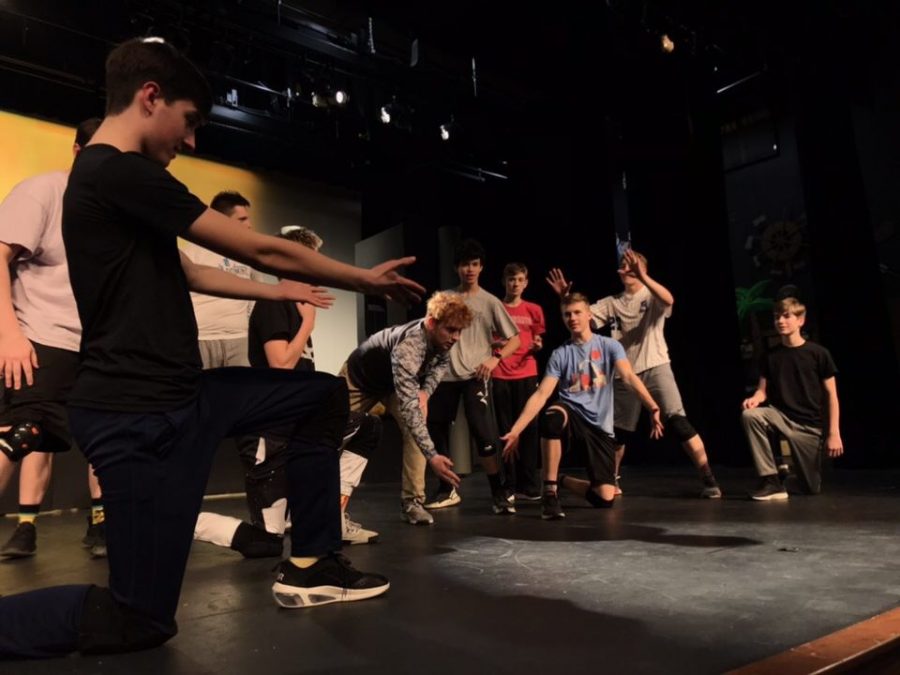 The boys of “Guys & Dolls” practice their choreography in preparation for opening night. 