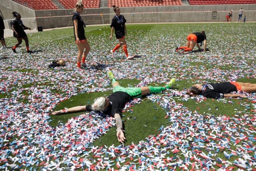 The Houston Dash celebrate after winning their summer tournament in the first successful professional sports bubble.