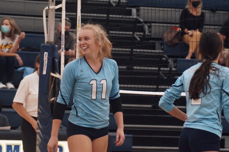 Senior Audrey Weber looks back on her team with a proud smile 