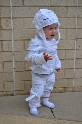 Little boy models an easy at home mummy a Halloween Costume. 