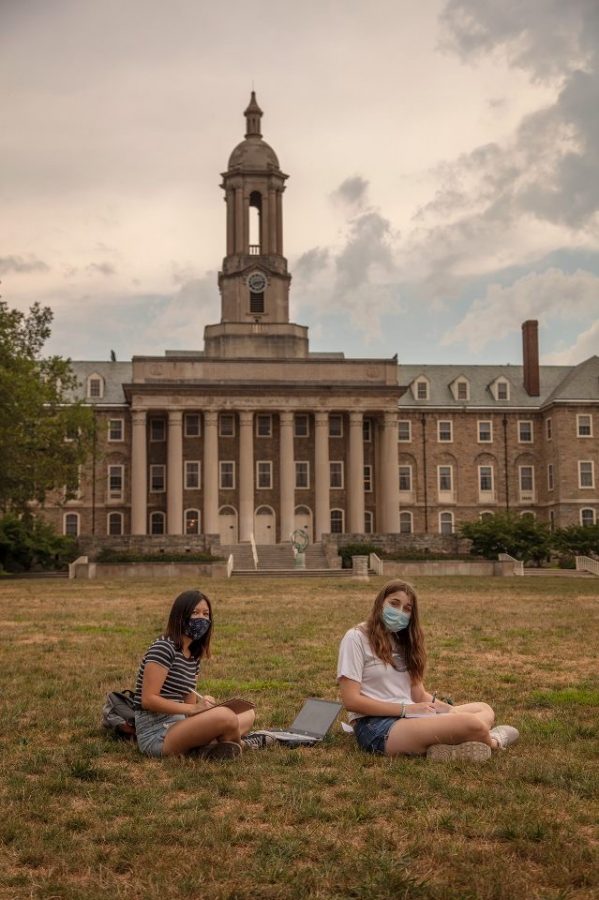 Two+college+sophomores+wear+masks+as+they+return+to+campus