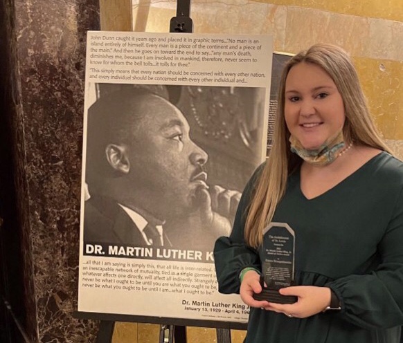 Senior Emma Bruegenhemke receiving her MLK Model of Justice award 