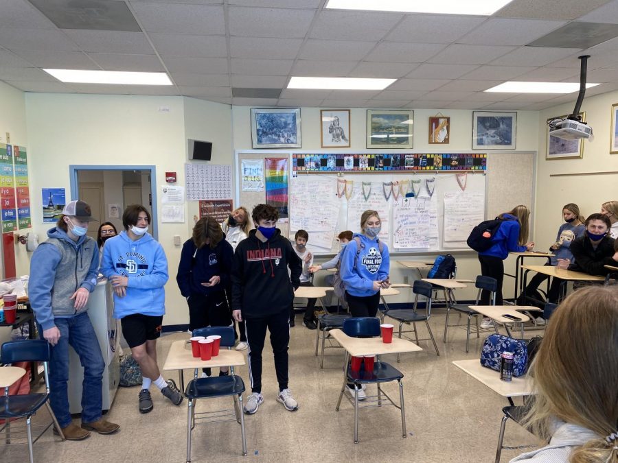 Mr. Small's and Mrs. Lang's family plays a round robin tournament  of cup pong