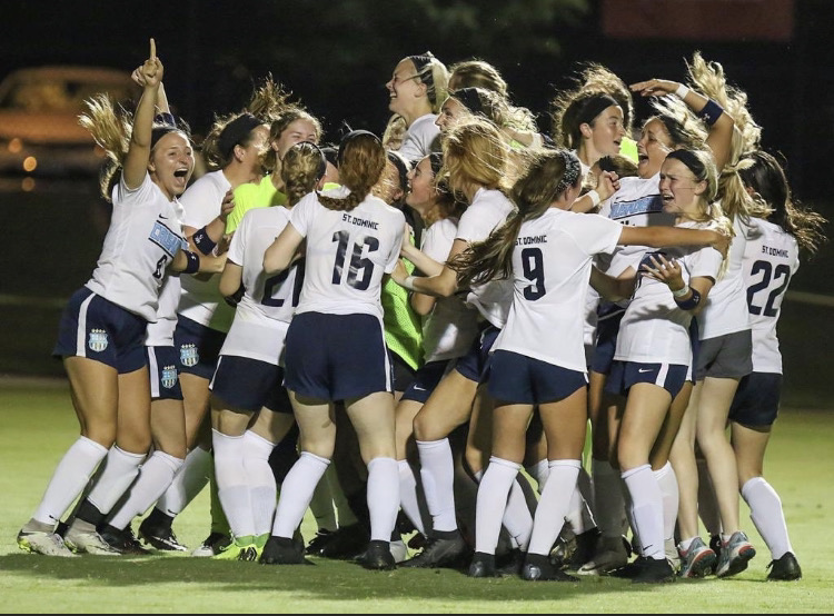 St. Dominic’s soccer team celebrates their 2019 State win. 