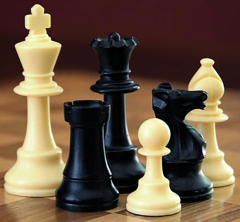 Black and white chess pieces used to capture enemy pieces.