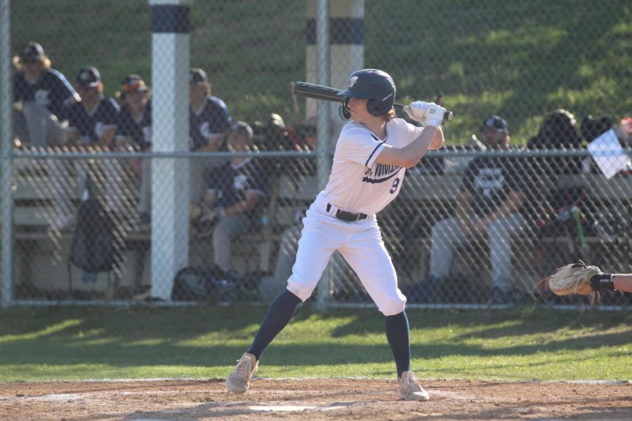 Cole Beerman winds up at bat during important JV game. 