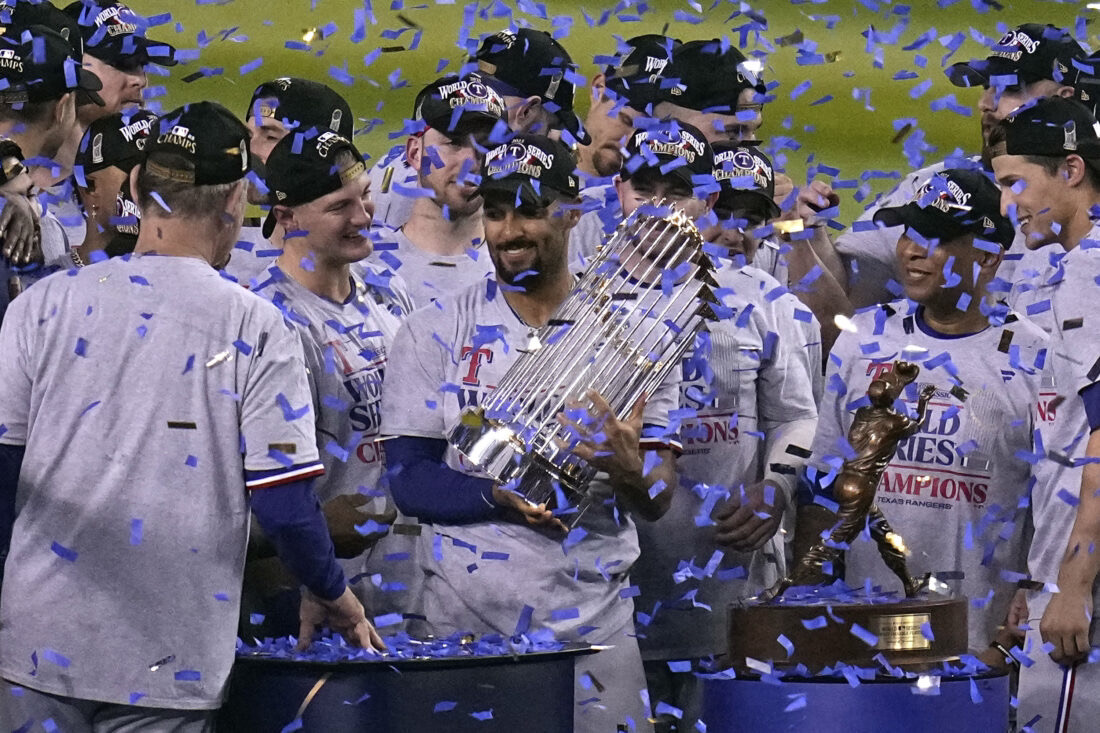 Texas Rangers Marcus Semien hoists up the World Series trophy