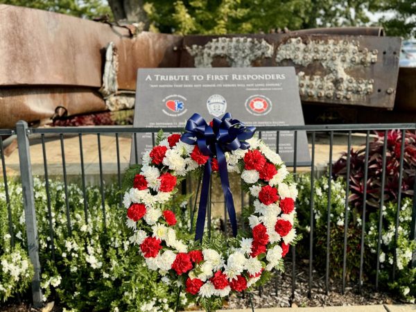 O'Fallon civilians place a wreath at the First Responders Memorial 